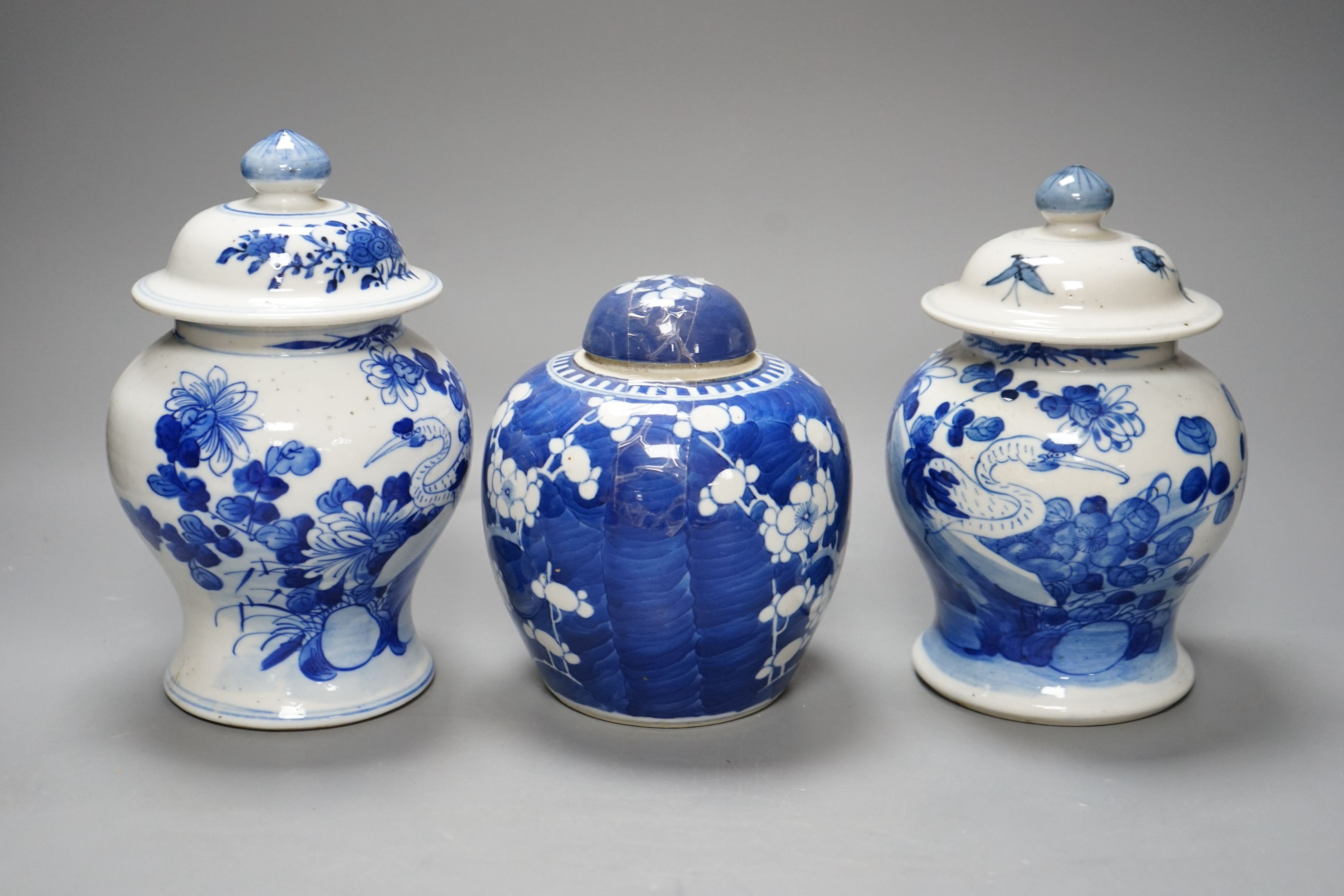 A pair of Chinese jars and covers and a prunus jar and cover circa 1900, jars and covers 21cms high